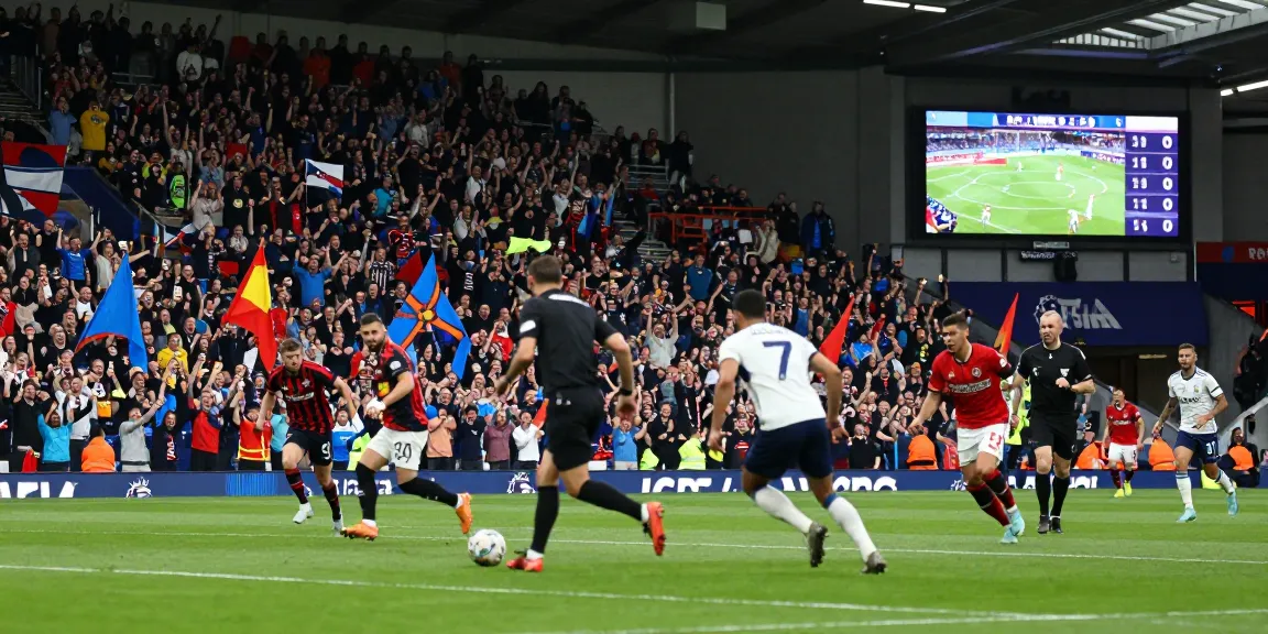 Exciting football match atmosphere showing fans and players in action at a BK8th Premier League event.